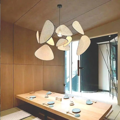 Aesthetic rattan statement light fixture creating a cozy and warm relaxing atmosphere for a master bedroom