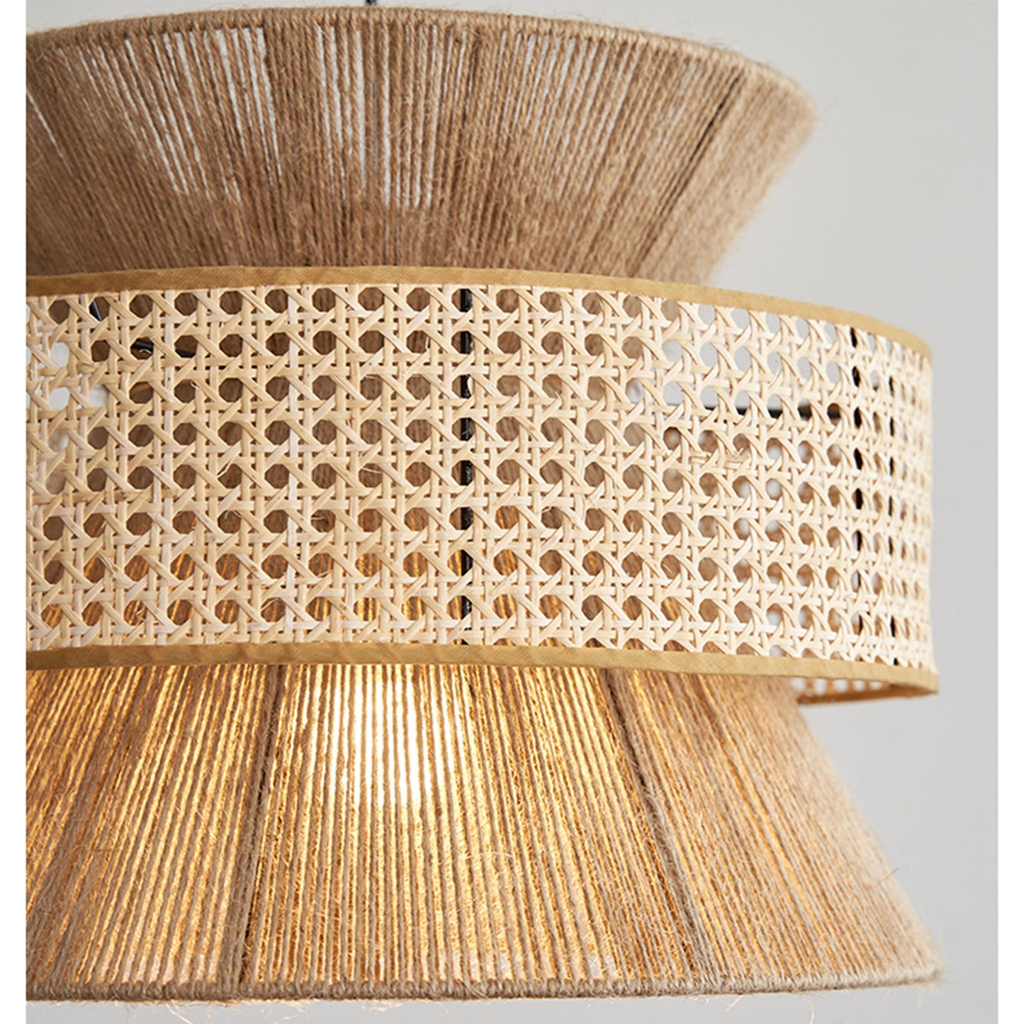 Architectural cane webbing pendant light combining tight rope wrapping and open-work wicker patterns for a textured look.