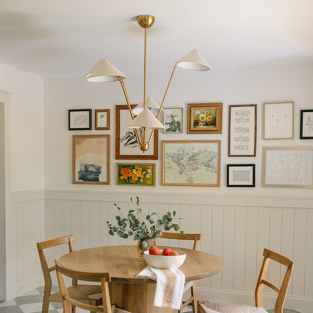 Artistic brass cone chandelier perfect for sophisticated dining room decor