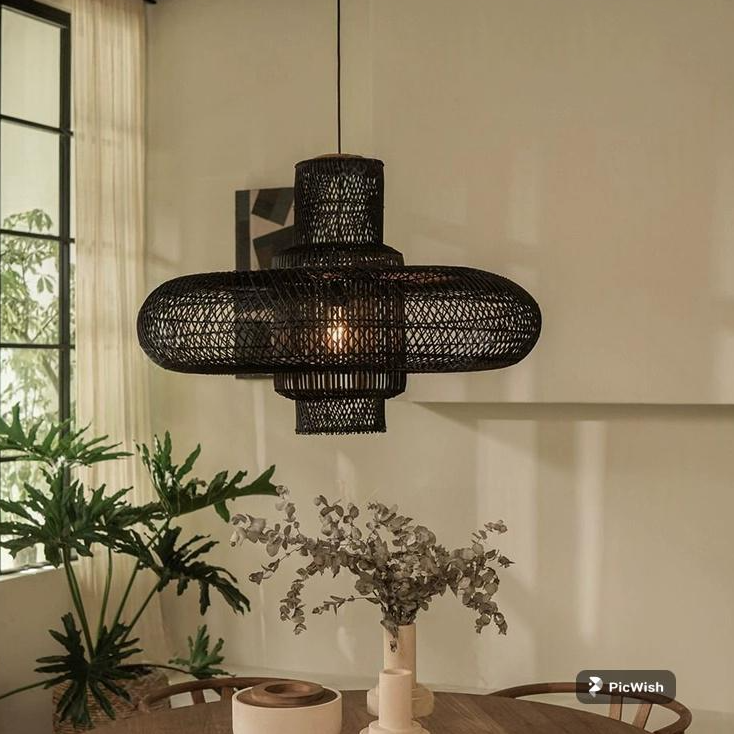 Wabi-sabi lamp ceiling pendant made of textured spindle rattan, casting soft light in a minimalist bedroom.