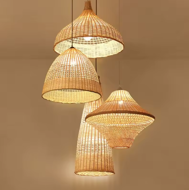 Cascading wicker cluster pendant chandelier with four unique natural fiber shades radiating a warm amber glow.