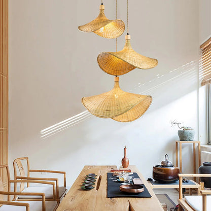 Tropical wave wicker chandelier bringing a fresh, breezy coastal resort aesthetic into an urban apartment.