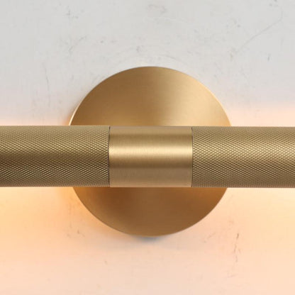 Ambient copper wall sconce lighting for a refined dining room gallery space