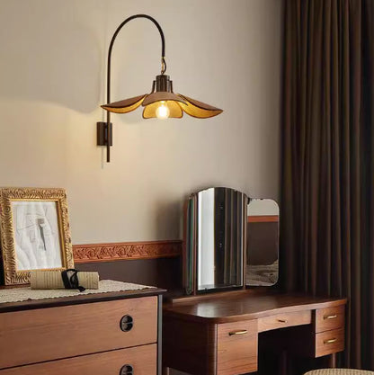 Cozy bedroom mood lighting featuring a beautiful curved wood and fabric lamp