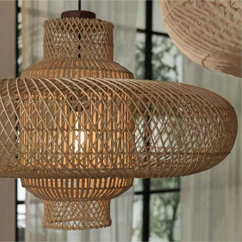 All-natural drop light displaying hand-woven open lattice work, casting soft shadows in a calming yoga room.