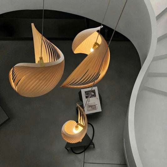 Drop light made from eco-friendly wood, perfect for staircase spaces, adding sculptural lighting appeal.