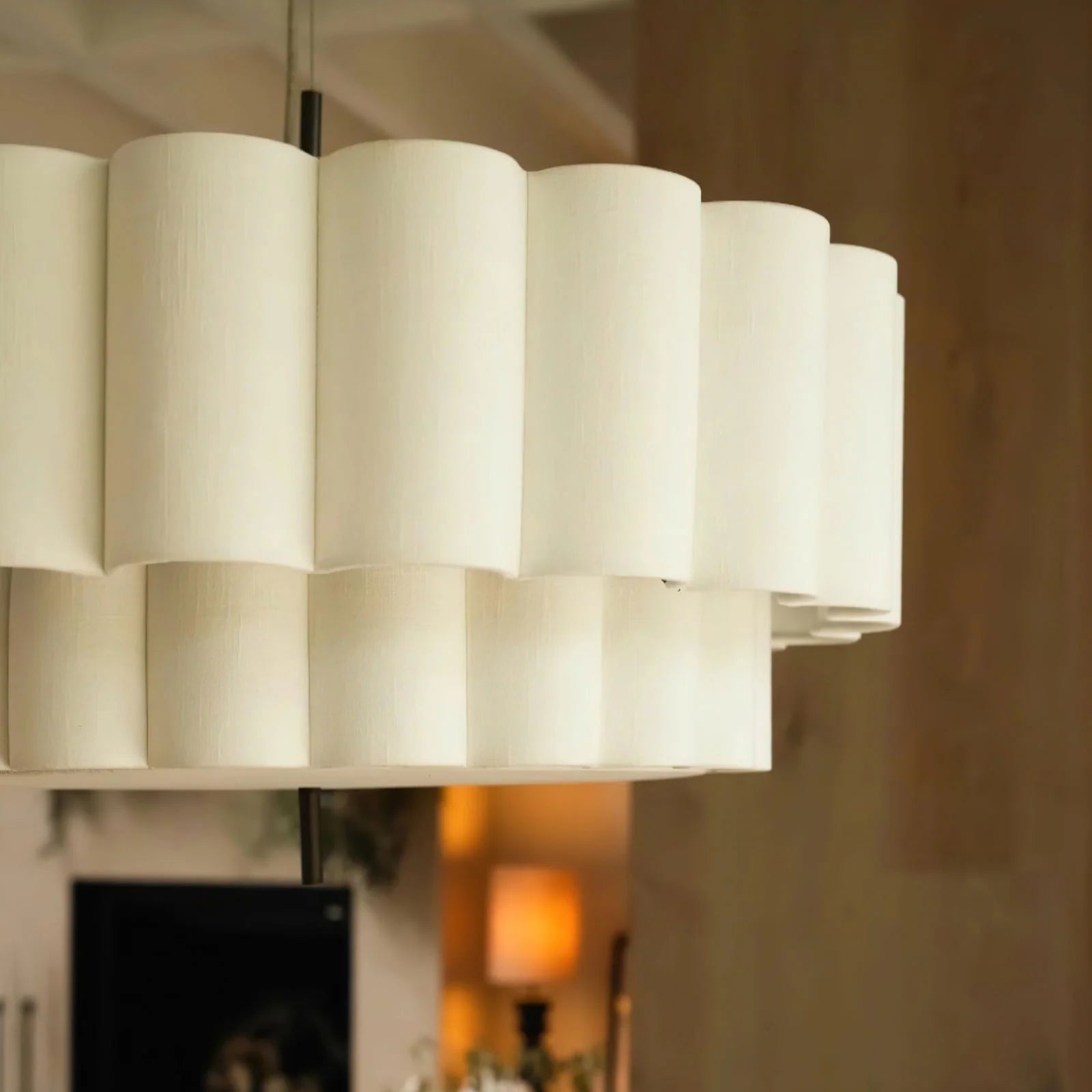 Drop light featuring handmade fabric, perfect for a cozy home bar, offering warm, inviting accent lighting.