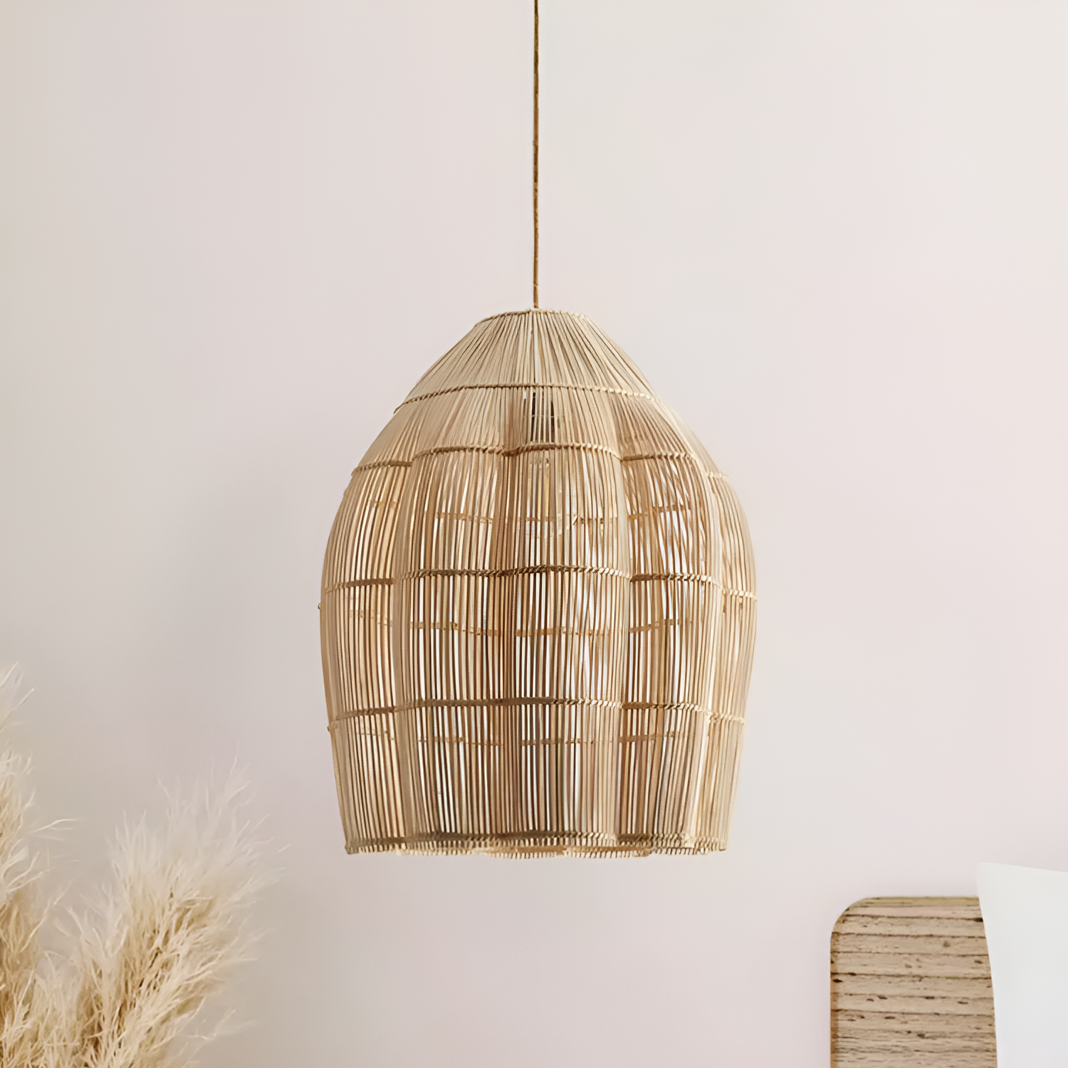 Eco-chic hand-wrapped rattan bell pendant, a sophisticated minimalist accent for sustainable interior styling.