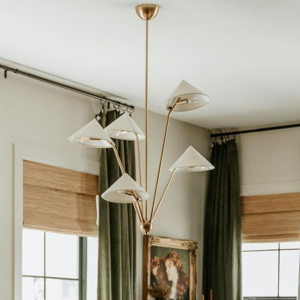 Elegant brass multi-cone chandelier in a Wabi-Sabi home interior