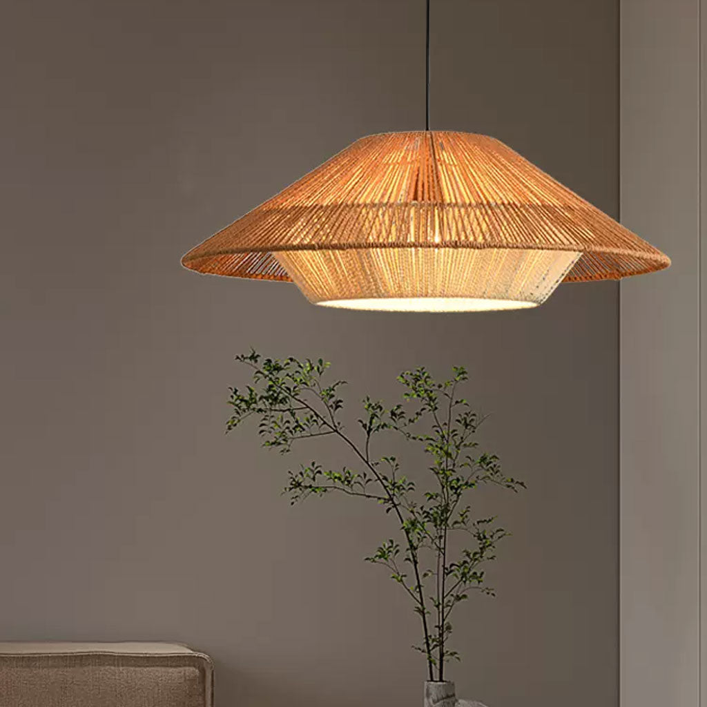 Layered straw conical ceiling light comparison with a glowing amber light bulb illuminated through fine organic cord wrappings.
