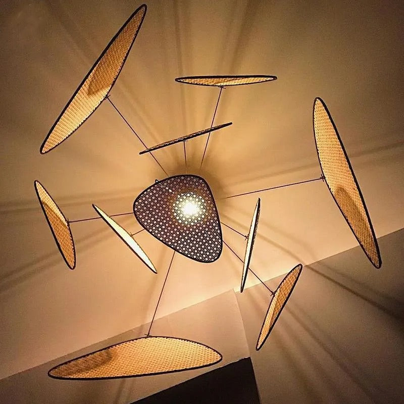 Grand rattan webbing chandelier with an organic multi-leaf design, perfect for high-ceiling living rooms.