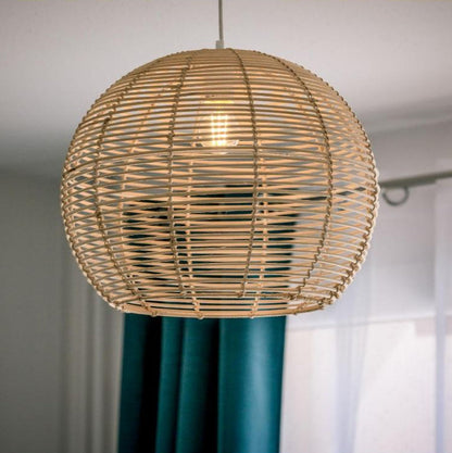 Hand-made sustainable rattan ceiling light featuring a classic globe shape