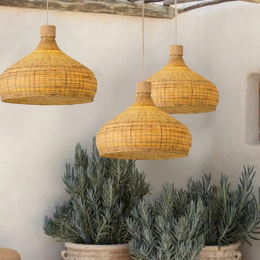 Hand-woven natural bamboo pendant light with an intricate pattern for a rustic look.