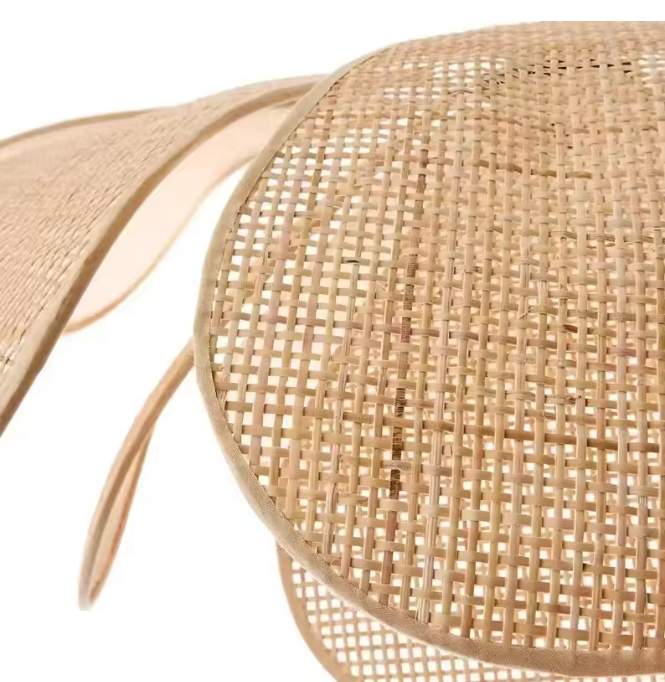 Artisan crafted rattan petal light highlighting the flawless criss-cross knit mesh basketry and high-quality sustainable split-bamboo fibers.