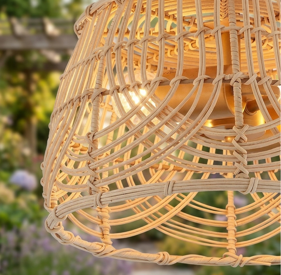 Handcrafted natural rattan flush mount ceiling light with intricate woven details and a brass base.