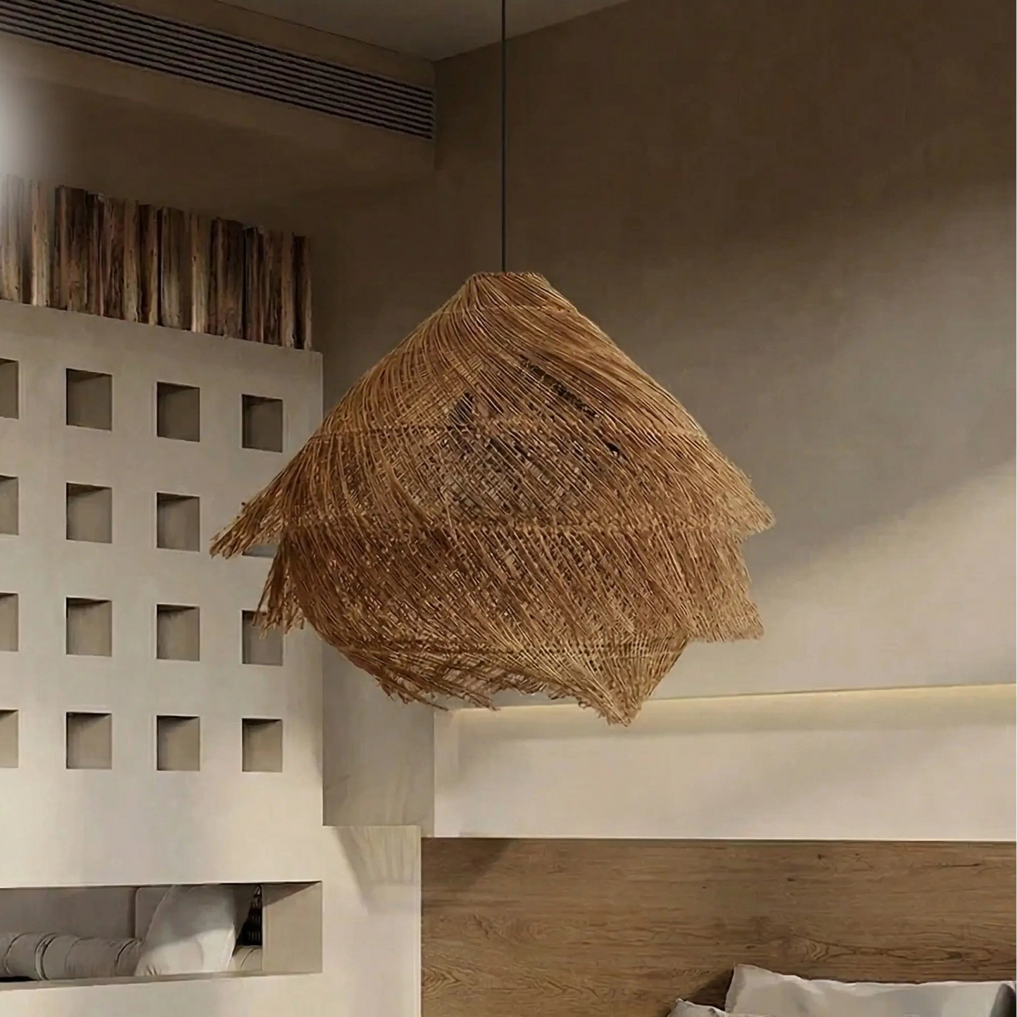 Artisan woven grass chandelier showing meticulous organic craftsmanship and detailed layered construction.