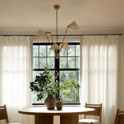 Handcrafted designer chandelier with textured cone shades and brass arms
