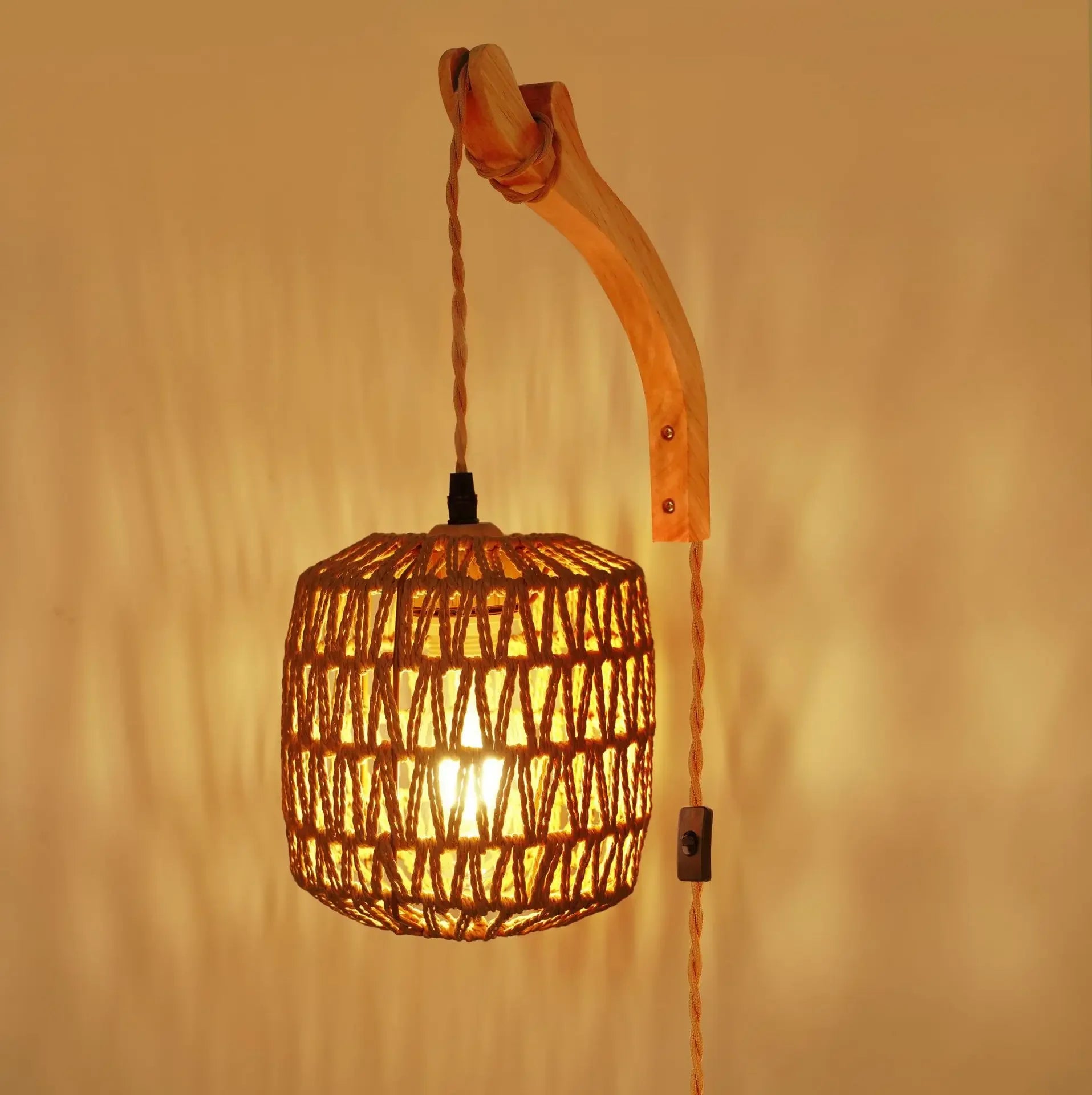 Woven pendant light with wooden arm against a warm beige background
