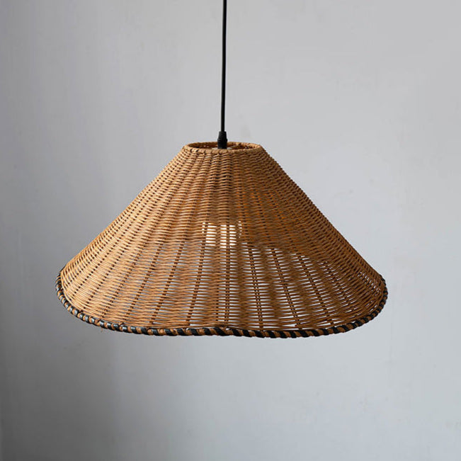 Handwoven rattan cone pendant light hanging in a bar shown in image_f1b8d6.jpg
