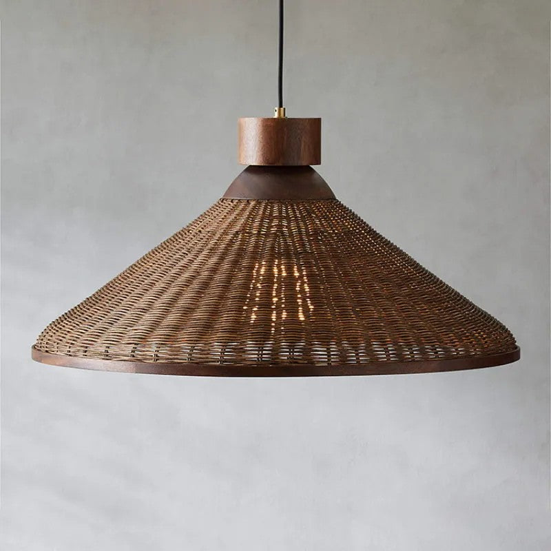 Handwoven rattan and wood mesh pendant lamp featuring detailed artisan fiber craftsmanship.