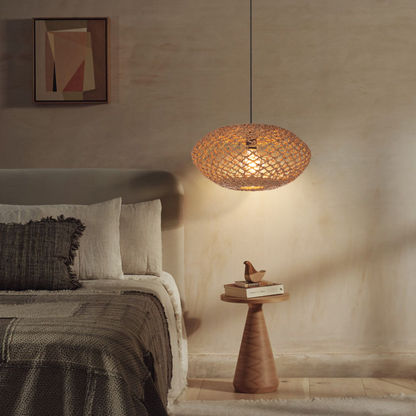 Handwoven seagrass pendant light creating a calming and rustic atmosphere for a peaceful bedroom