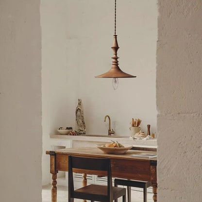 Hanging lamp in modern turned wood style, perfect for dining table lighting, offering beautiful accent light.