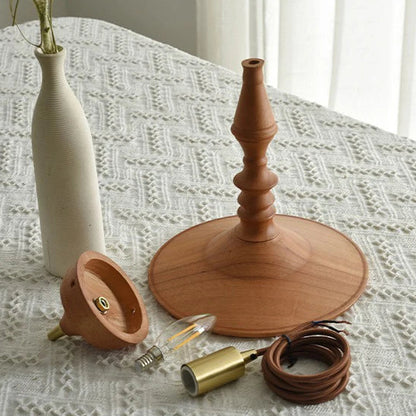 Hanging lamp in Neoclassic style, crafted from turned wood, perfect for bringing natural warmth to your interior decor.