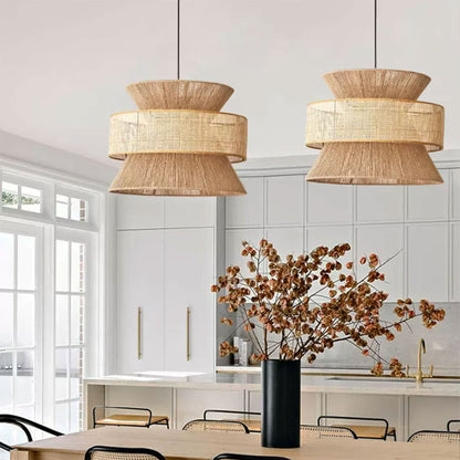 Large statement tiered wicker chandelier styled perfectly in a warm organic modern kitchen with rich wooden cabinetry.