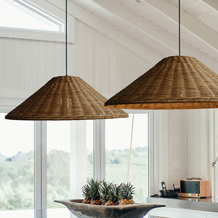 Minimalist natural fiber cluster ceiling fitting styled in a warm neutral interior alongside a fluted sideboard cabinet and cane chair.