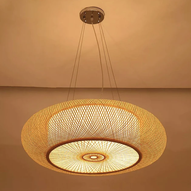  Large Japandi rattan saucer pendant light with an intricate criss-cross weave pattern throwing a warm radial glow 