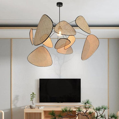 Minimalist Japandi hanging chandelier with natural rattan webbing panels creating a dramatic, organic silhouette