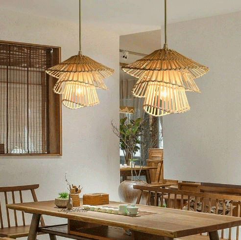 Minimalist Japandi straw weave pendant light installed in a room with warm neutral wall tones.