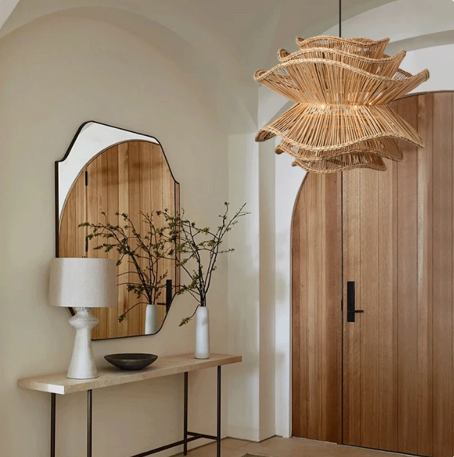 Handcrafted wavy rattan hanging light fixture perfect for a Nordic or Wabi-sabi dining room theme