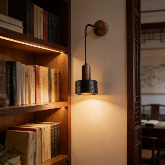 Eco-friendly hand-assembled botanical wood and stone sconce bringing pure natural textures to a cozy reading corner.