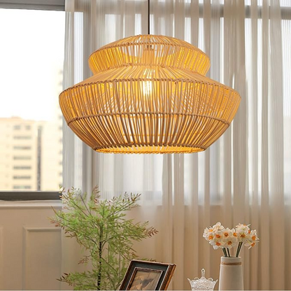 Large artisan rattan pendant lamp hanging over a stylish dining room table