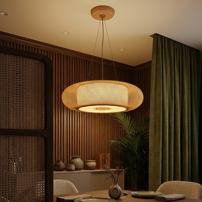 Low profile wicker pendant shade with a multi-wire suspension system glowing beautifully against a plain ceiling.