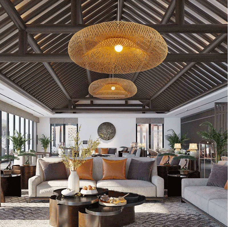 Aesthetic wicker kitchen lamp in a shallow bowl shape casting comfortable ambient lighting over a dining area.