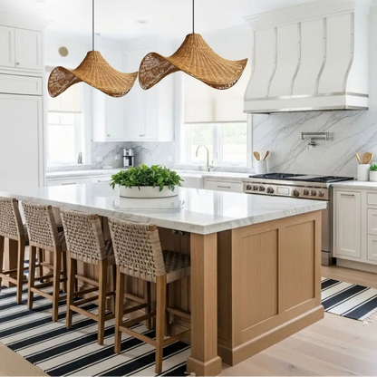 Modern wavy rattan pendant light suspended elegantly over a kitchen island for organic task lighting