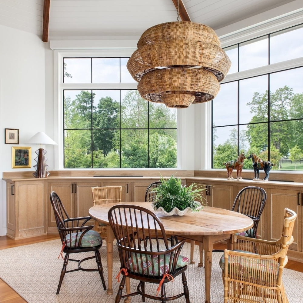 Elegant multi-tier kitchen island light casting comfortable ambient glare-free illumination, perfect for a cozy dining area.