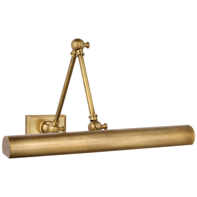 Organic modernism brass art light for an elegant gallery entryway