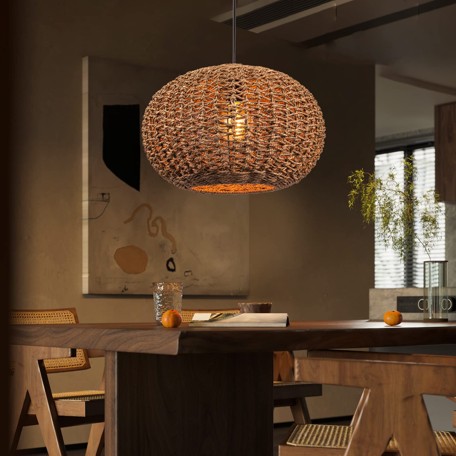 Large handwoven high-quality jute pendant light hanging over a rustic dining table