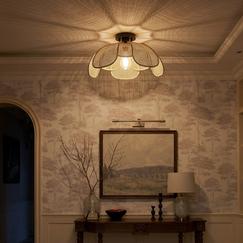 Inviting natural rattan flower ceiling light installed in a stylish home entryway.