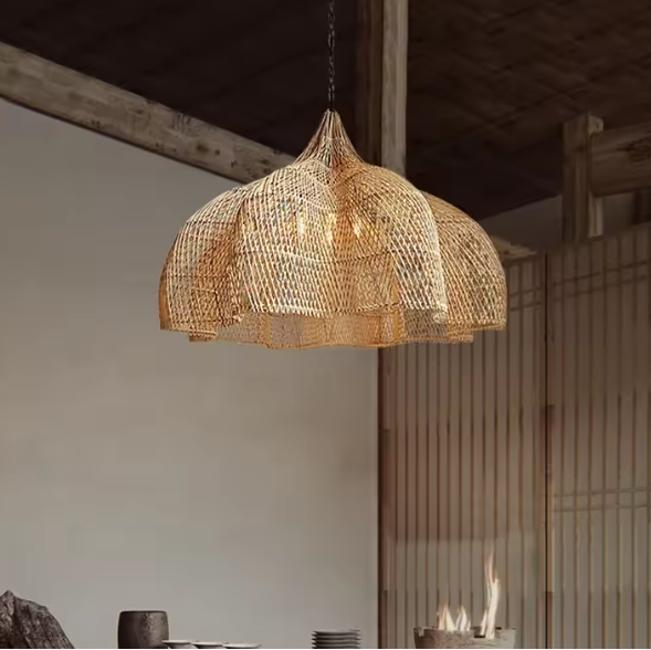 Large flared dome straw hanging lamp displaying a beautiful undulating scalloped rim and warm inner lighting.