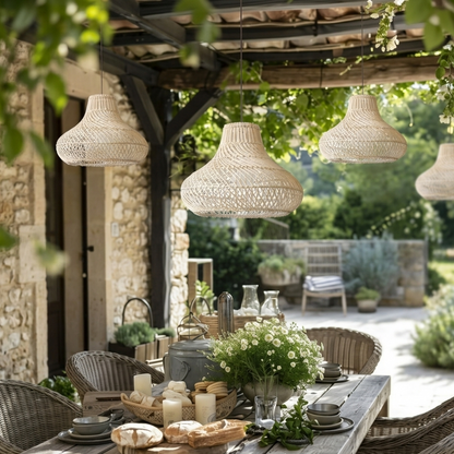 Organic White rattan bell pendant light fixture perfectly suited for a covered outdoor garden patio area.