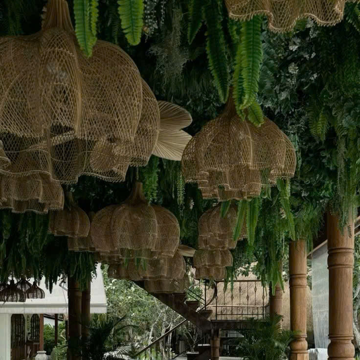 Statement  rattan pendant light creating a cozy, artistic ambiance for modern cafe interiors
