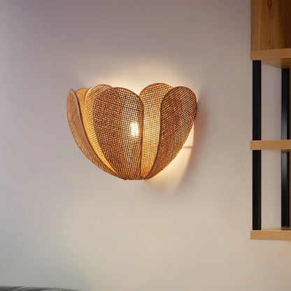 Ambient rattan wall sconce lighting for a refined dining room space