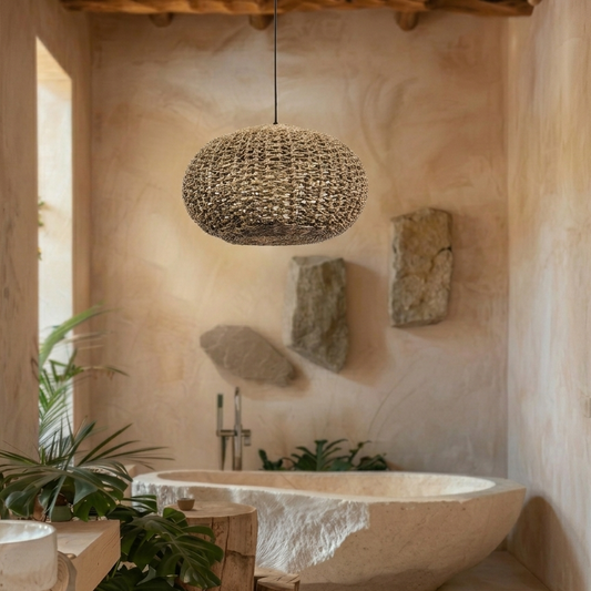 Soft glowing jute pendant light creating a spa-like atmosphere over a freestanding bathtub