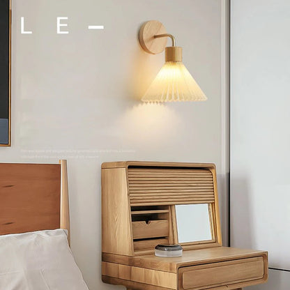 Wooden vanity with mirror next to a bed in a bedroom setting, with 'CIRCLE' branding.