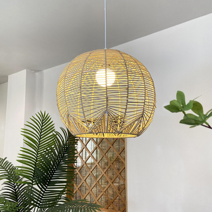 Coastal interior design featuring a large woven rattan dome chandelier