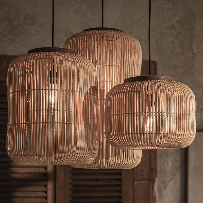 High ceiling entryway bamboo lantern light with exposed warm filaments behind vertical woven slats.